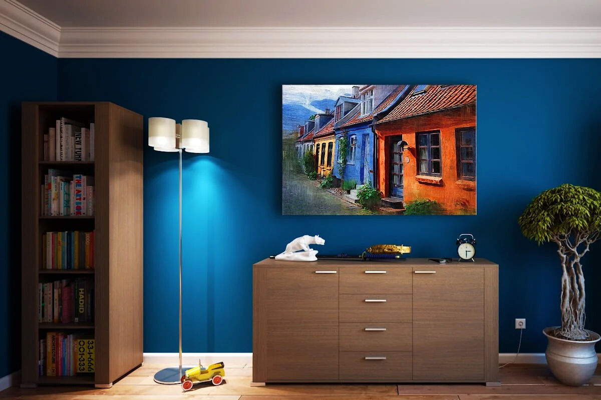 Modern living room featuring stylish bookshelves and vibrant painting